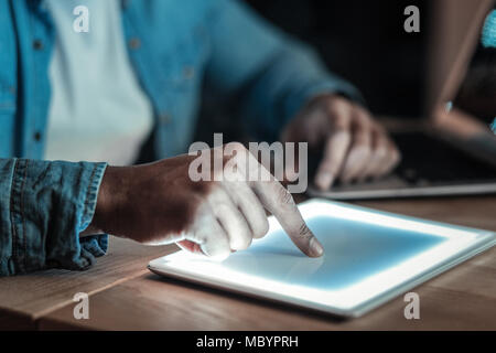 Male afro American hands touching sensor screen Stock Photo