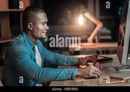 Attractive IT guy debugging Stock Photo