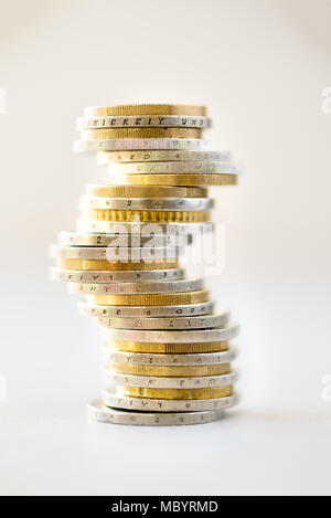 Euro money, currency. Success, wealth and poverty, poorness concept. Euro coins stack on grey background with copy space. Stock Photo