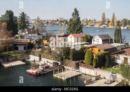 Small houses with garden on old Danube river in Vienna Austria, April.11, 2018 Stock Photo