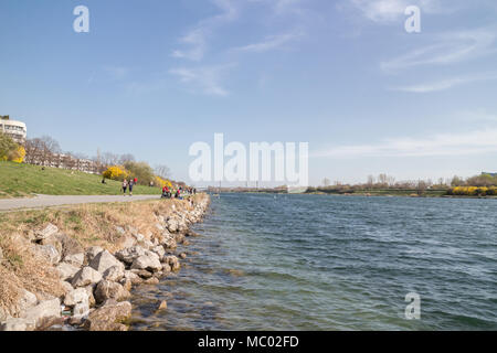 Danube isle and Danube river, people enjoying fair weather, Vienna Austria April.11, 2018 Stock Photo