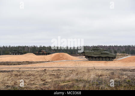 https://l450v.alamy.com/450v/mc0368/from-left-to-right-canadian-polish-and-spanish-soldiers-and-their-vehicles-test-a-newly-built-tank-range-at-adazi-training-area-latvia-jan-09-2018-the-us-armys-training-support-activity-europe-tsae-conducted-a-final-inspection-and-test-of-the-facility-as-tsae-is-assisting-nato-allies-in-eastern-europe-develop-their-range-and-training-infrastructures-us-army-photo-by-markus-rauchenberger-mc0368.jpg