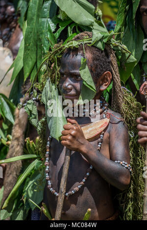 A boy of Kumipana Warrior Women Group parading at Mount Hagen Cultural Show, Papua New Guinea Stock Photo