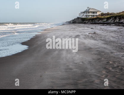 Trails of moving sand can be seen from coastal winds along private beaches in Vero Beach, Florida. Stock Photo