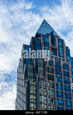 VANCOUVER, CANADA - February 18, 2018: Cathedral Place Building against blue sky with clouds. Stock Photo