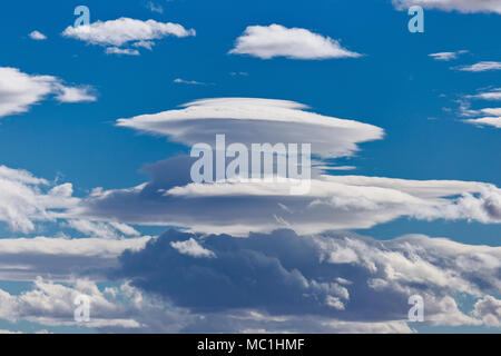 Lenticular clouds (Altocumulus lenticularis) resembling a UFO, in the sky above Kanab, Utah Stock Photo