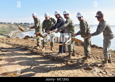 180119-N-VV353-113  ROTA, Spain (Jan. 19, 2018) Commanding officers from Naval Station Rota, Spanish Navy, Naval Mobile Construction Battalion (NMCB) 133, Task Force 68 and Public Works participate in a groundbreaking ceremony at the Cliff Erosion Repair project site. The project is a multiyear effort to stabilize 950 meters of shoreline encompassing the Naval Station Rota's base housing area as a permanent solution to cliff erosion. (U.S. Navy photo by Mass Communication Specialist 3rd Class M. Jang/Released) Stock Photo