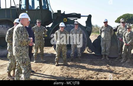 180119-N-VV353-100 NAVAL STATION ROTA, Spain (Jan. 19, 2018)- Naval Station Rota Commanding Officer Capt. Mike MacNicholl makes an opening speech to attendees during a groundbreaking ceremony at the Cliff Erosion Repair project site Jan. 19, 2018. The Cliff Erosion Repair project is a multiyear effort to stabilize 950 meters of shoreline encompassing the Naval Station Rota’s base housing area as a permanent solution to cliff erosion. (U.S. Navy photo by Mass Communication Specialist 3rd Class M. Jang) Stock Photo