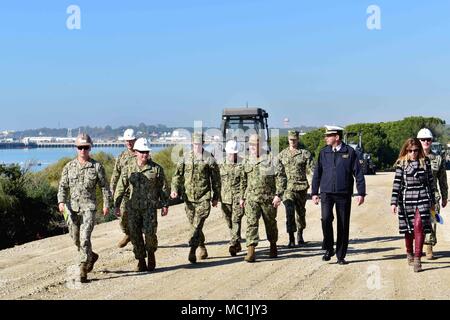 180119-N-VV353-079  ROTA, Spain (Jan. 19, 2018) Commanding officers from Naval Station Rota, Spanish Armada, Naval Mobile Construction Battalion (NMCB) 133, Task Force 68 and Public Works walk to the Cliff Erosion Repair project site to hold a ceremonial ground breaking event. The project is a multiyear effort to stabilize 950 meters of shoreline encompassing the Naval Station Rota's base housing area as a permanent solution to cliff erosion. (U.S. Navy photo by Mass Communication Specialist 3rd Class M. Jang/Released) Stock Photo