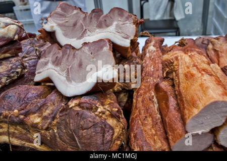 Various products from dried meat exposed to view and tasting before sale. Stock Photo