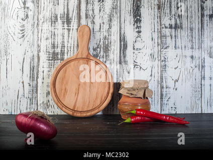 Round cutting board wooden background Stock Photo