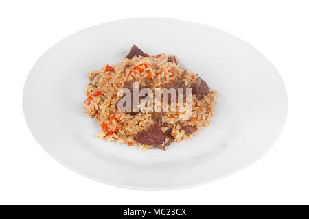 Pilaf, rice with meat, beef, lamb, with onion and carrots, serving on plate, Appetizing, juicy on white isolated background side view. For the menu, r Stock Photo