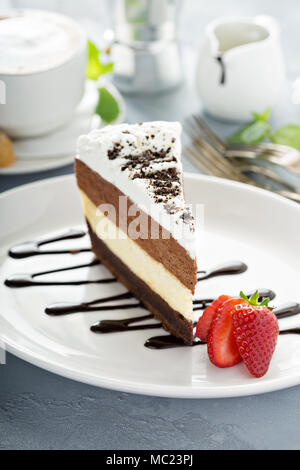 Three chocolate layered mousse cake Stock Photo