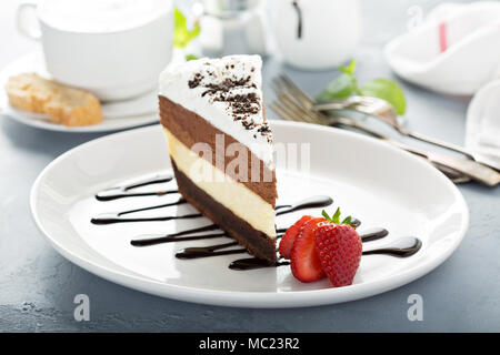 Three chocolate layered mousse cake Stock Photo