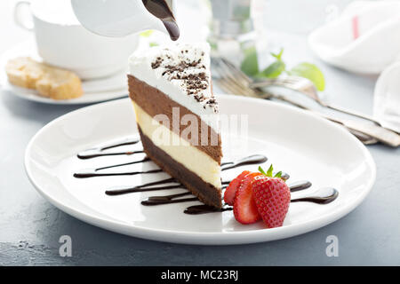 Three chocolate layered mousse cake Stock Photo