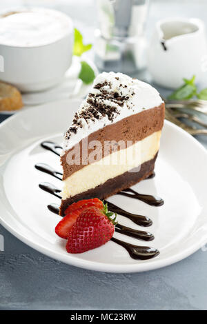 Three chocolate layered mousse cake Stock Photo