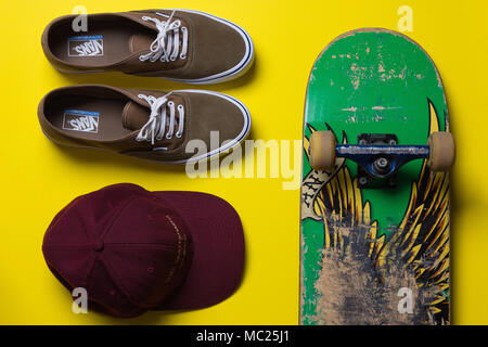 skateboard and skate gear against a bright background, top view