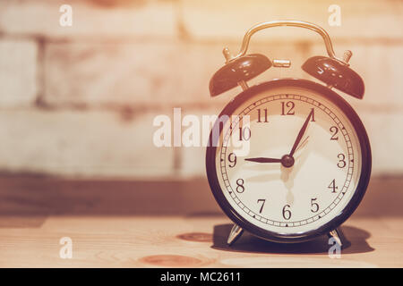 Analog alarm clock showing nine o'clock, 9pm or 9 am isolated on white ...