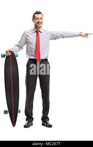 Full length portrait of businessman with a longboard pointing isolated on white background Stock Photo