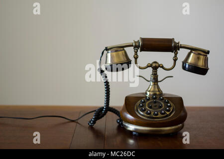 Vintage phone on wooden table Stock Photo