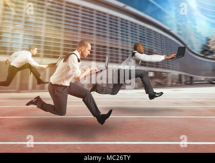 Business men working at full speed in a race track Stock Photo