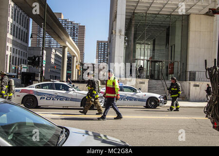 Detroit, Michigan, USA - March 22, 2018: Firefighters and police responding to a call in the downtown business district of Detroit. Stock Photo