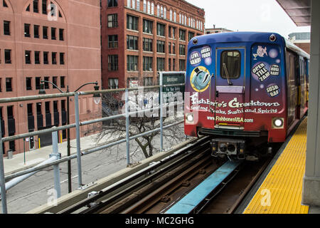 The Detroit People Mover leaves the station in downtown Detroit. The People Mover is a mass transit rail system that loops through the city with sever Stock Photo