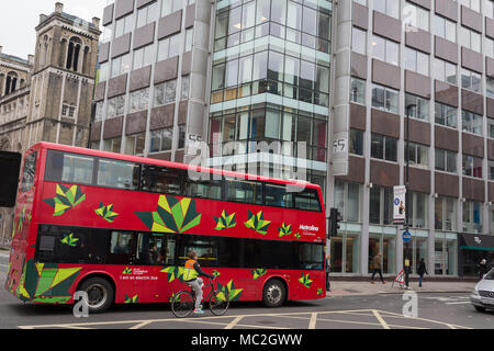 The day after Facebook's Mark Zuckerberg faced Senate Committee questions in Washington, a London bus drives past the offices of Cambridge Analytica on New Oxford Street, the UK tech company accused of harvesting the personal details of Facebook users in its data privacy scandal, on 11th April, 2018, in London, England. Stock Photo