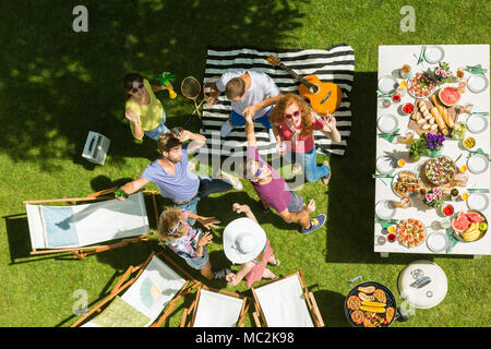 Grill party among best friends enjoying, delicious food, and warm weather Stock Photo