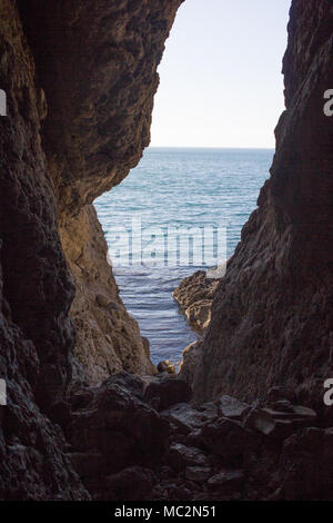 Stunning views of the sea from the natural cave. Inside view. Stock Photo
