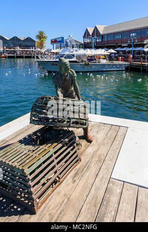 Fremantle Fishing Boat Harbour jetty and Fishermen memorial with views over to Cicerello's and Kalis Bros restaurants, Fremantle, Western Australia Stock Photo
