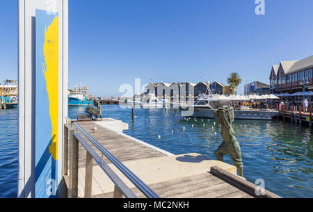Fremantle Fishing Boat Harbour jetty and Fishermen memorial with views over to the waterfront restaurants, Fremantle, Western Australia, Australia Stock Photo