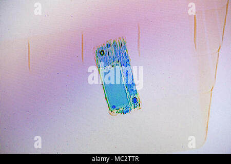 X-ray screenshot of a bag with a smartphone. Stock Photo