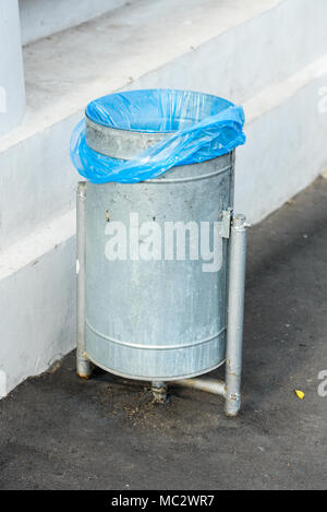 street metal trash with a package Stock Photo