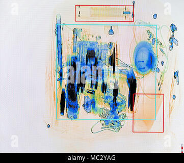 X-ray screenshot of an backpack filled with tele zoom camera and camcorder. Stock Photo