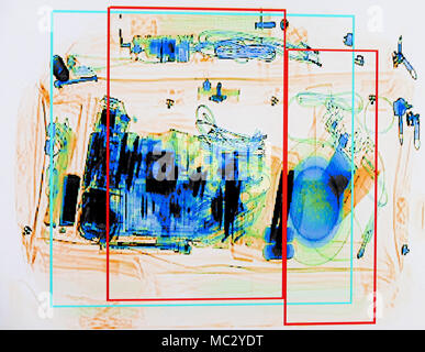 X-ray screenshot of an backpack filled with tele zoom camera and camcorder. Stock Photo