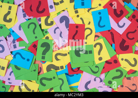 colorful paper with question mark as background. mystery,diversity,questions concept Stock Photo