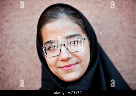 Teenager dressing chador. Abyaneh - Iran Stock Photo