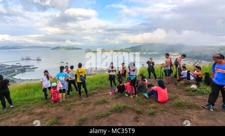 Sabah, Malaysia - August 06, 2016 : A group of  hikers taking selfie on top of the mountain . Image has grain or subject is blurry or noise or out of Stock Photo