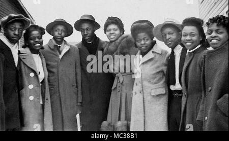 A group of African-American young people get together for a group photograph, ca. 1943. Stock Photo