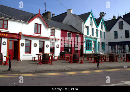 the harbour front of baltimore, west cork, ireland, with its colourful, colorful restaurants and pubs, a popular tourist and holiday destination Stock Photo