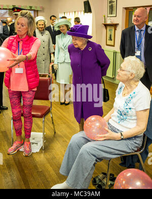 Queen Elizabeth II watches elderly keep fit enthusiasts being put