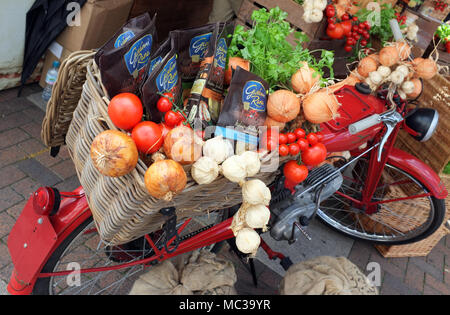 Fruit & Veg display on a vintage motorcycle at a farmers market and food fair stall in England UK Stock Photo