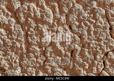 Horizontal surface of plastered wall, light brown clay plaster of rough work, backdrop texture. Stock Photo