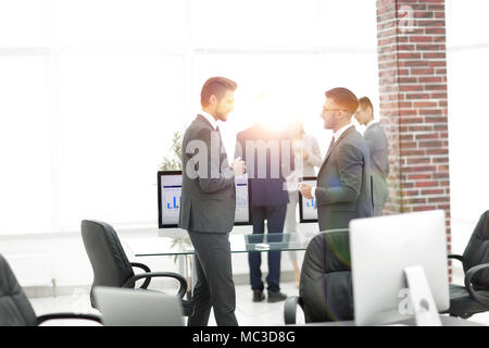 caucasian business people talking having a discussion conversation in office. Stock Photo