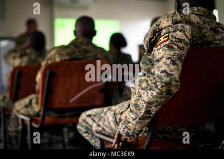 Ugandan People's Defense Force soldiers listen during the Civil Military Cooperation Civil Affairs Tactical Company Course (CCTCC) in Uganda, Africa, Feb. 16, 2018. The training is designed to enhance the UPDF's capability and capacity to support its enduring African Union peacekeeping force and African Union Mission in Somalia mandates. Stock Photo