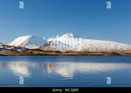 Lochan na h-Achlaise / Lochan Na h'Achlaise in winter and snow covered Black Mount, mountain range in Argyll and Bute, Scottish Highlands, Scotland Stock Photo