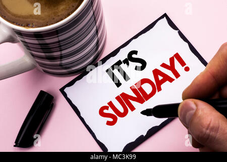 Handwriting text writing It's Sunday Call. Concept meaning Relax Enjoy Holiday Weekend Vacation Rest Day Free Relaxing written by Man Sticky Note pape Stock Photo