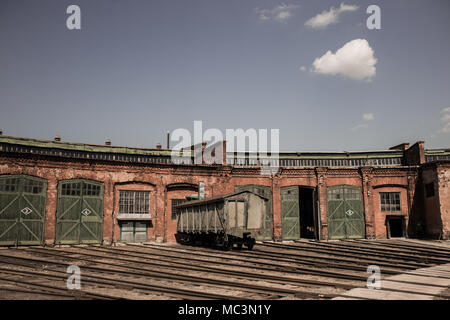Old rusty soviet wagon at abandoned railway platform. Horizontal color photography. Stock Photo
