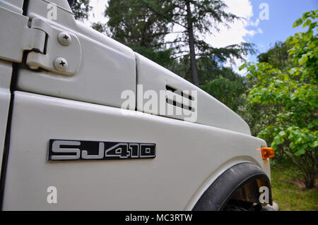 A white Suzuki Samurai with big wheels outdoors Stock Photo - Alamy